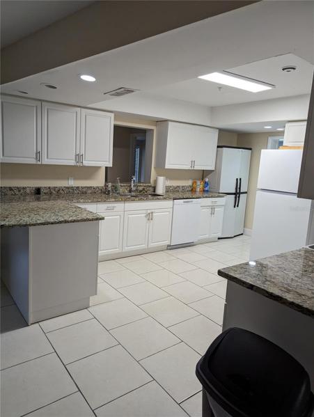 another view of the kitchen with plenty of cabinet space.