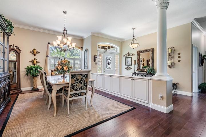 GRAND FOYER/Dining Room with Loads of storage and tasteful woodworking!