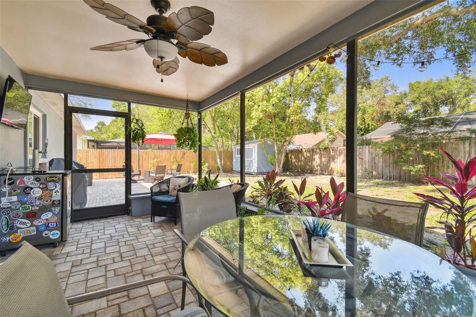 Screened in patio area with a fan