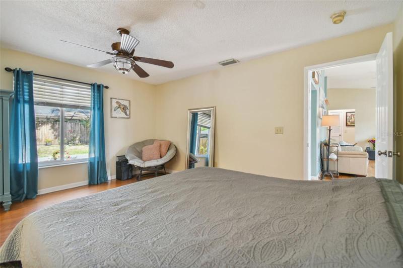 Master bedroom with walk in closet and en suite bathroom.