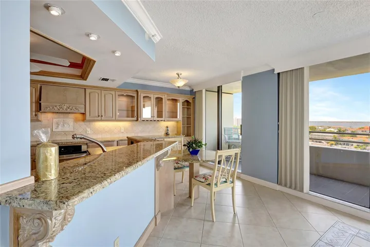 Granite counter, room for bar stools. Access 75' wrap around balcony
