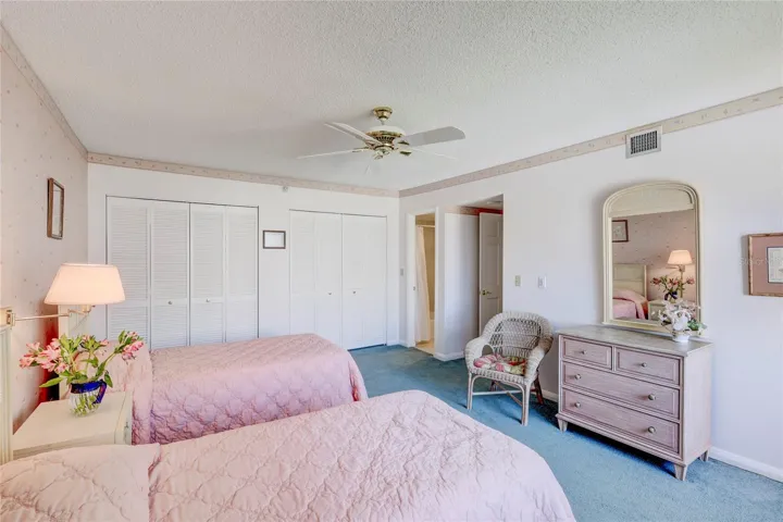 Guest bedroom #2 with  wall closets. Private access to guest bathroom or access by hallway.