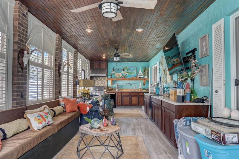 After you’re done splashing for the day prepare dinner in the OUTDOOR KITCHEN with a BUILT-IN SEDONA GRILL, tongue and groove ceiling, beverage fridge and kegerator all tucked away in the ENCLOSED and SCREENED LANAI!