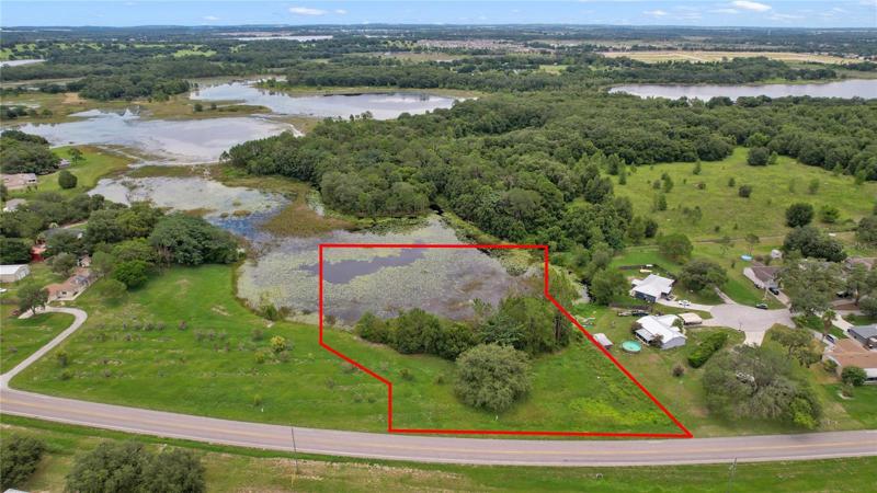 Over 2 ACRES with zoning that allows for 4 dwelling units per acre with a POND so build a custom home with WATER VIEWS or invest and build multiple homes!