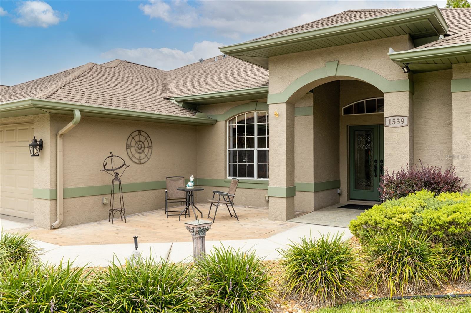 A beautiful front patio awaits as you approach the front door!