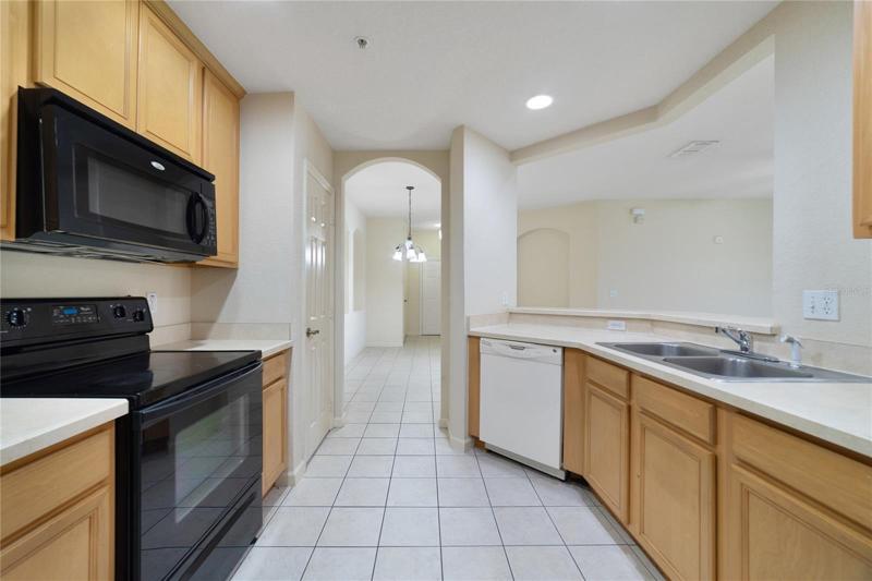 The comfortable kitchen offers plenty of cabinet and counter space, a closet pantry, recessed lighting and a breakfast for casual dining!