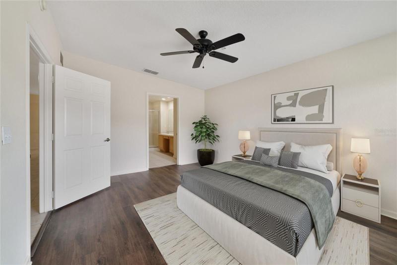 Your generous primary suite has a large window to let the natural light pour in, WALK-IN CLOSET and private bath with an extended dual sink vanity with space for seating and a glass enclosed shower! Virtually Staged.