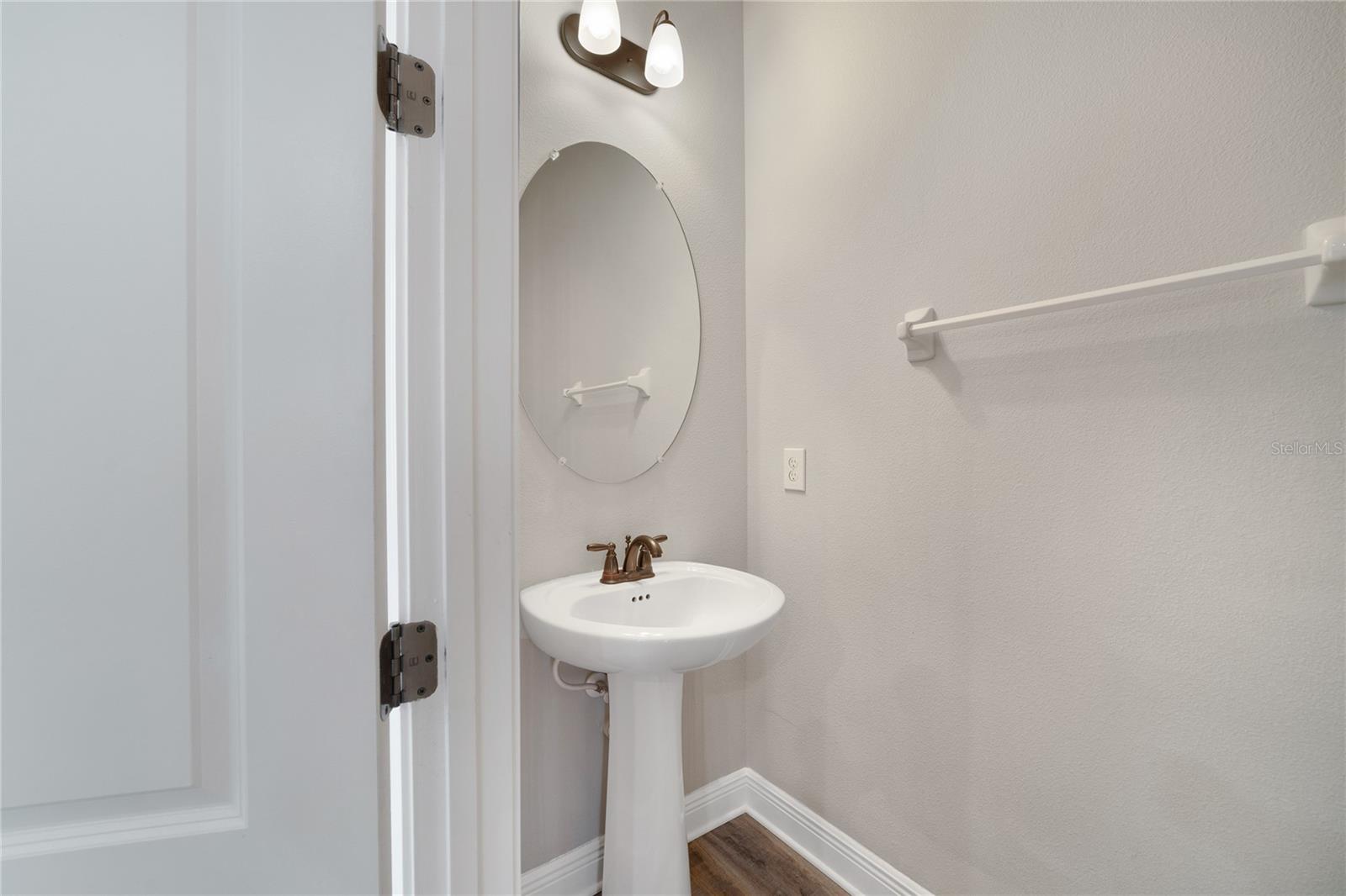 Convenient half bath off the living areas.