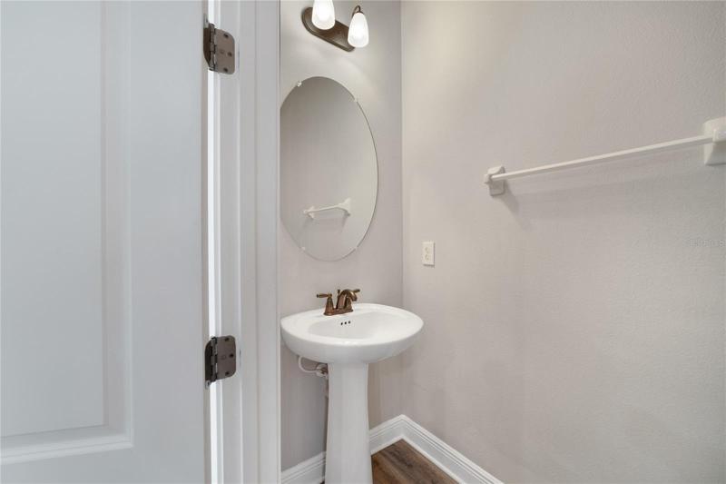 Convenient half bath off the living areas.