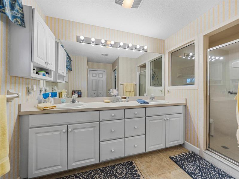 Master bath vanity with dual sinks and large walk in shower
