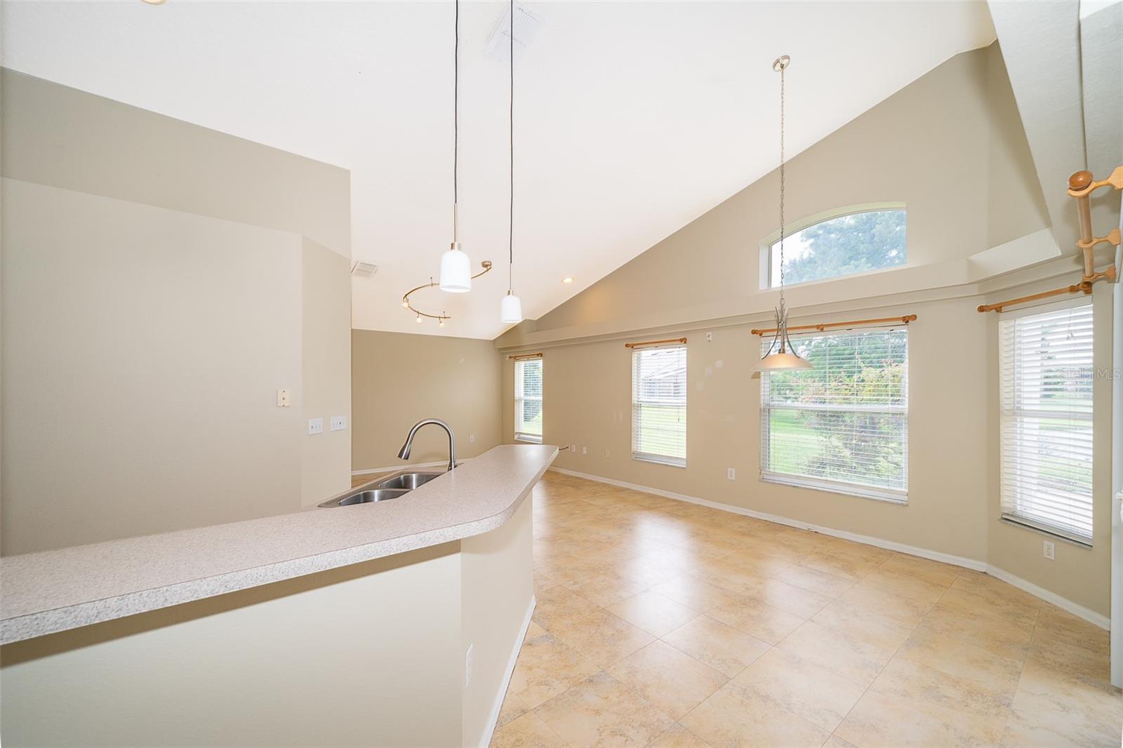 Kitchen Bar Opening to Family Room
