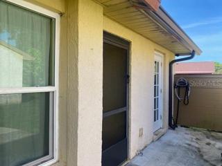Enter in through the screened in front door to the 2 bedroom and 2 bathroom townhome.