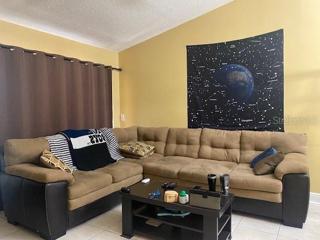The living room is spacious enough for a sectional.