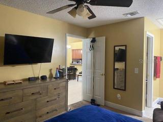 The master bedroom leads out to the living room.