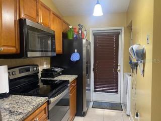 The kitchen's stainless steel appliances convey with the sale.