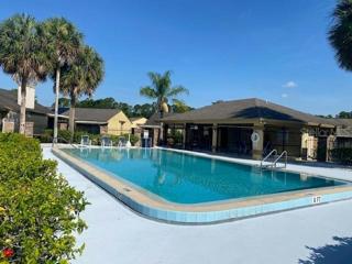 Another view of the pool and covered entertainment center.