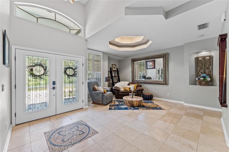 This home features a formal living and dining room area. The current homeowners use it for entertaining. They use the space as a cocktail area and pool table.