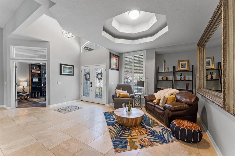 Inside this home you'll love the travertine flooring and coffered ceilings.