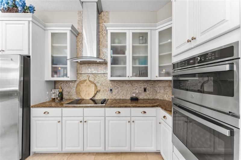 The kitchen features newly updated cabinetry, built in appliances and granite countertops.