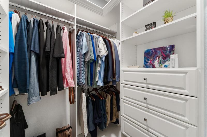 The master bedroom features two custom walk in closets.