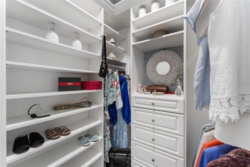 The master bedroom features two custom walk in closets.