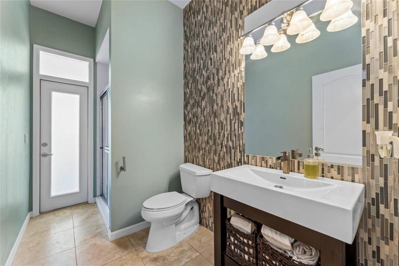 The home features a full pool bath complete with walk in shower.