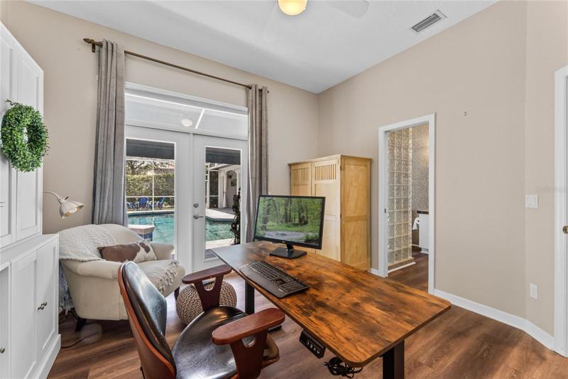 View of guest suite one with French door access to the pool deck.