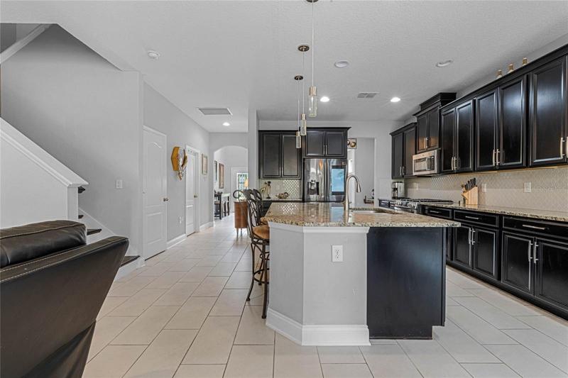 Other view of kitchen and staircase