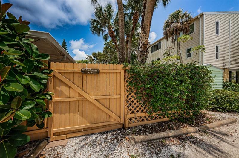 Wooded gate, from your courtyard to Beach Trail Dr.