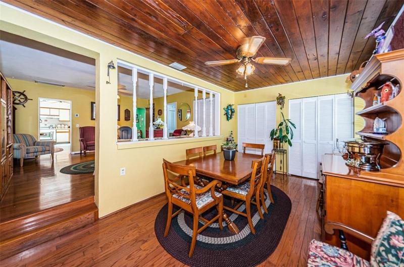 Dining Area/Enclosed Front Porch, steps up into Family Room.