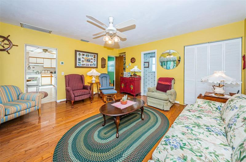 Family Room showing how layout opens up to Kitchen, Second Bedroom Ensuite and Guest/Half Bath.
