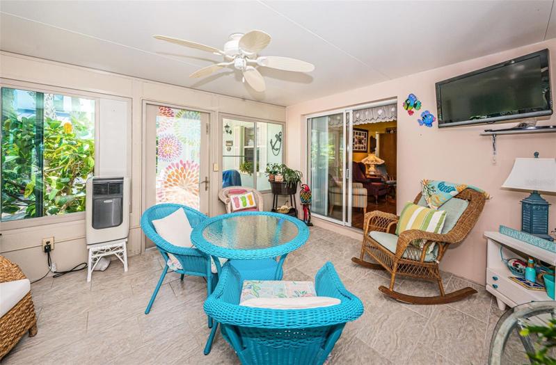 Florida Room has portable AC unit and opens up to the outdoor patio!