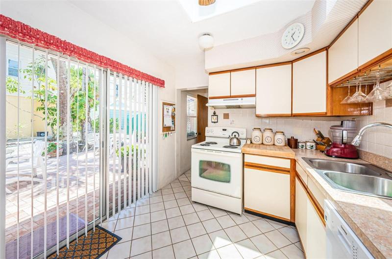 Kitchen slider opens to spacious patio for seamless entertaining!