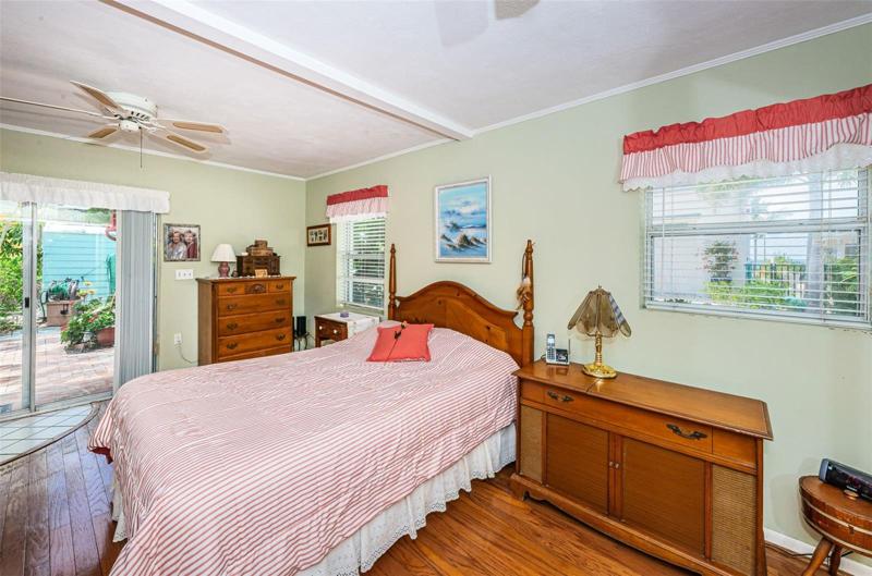 Master bedroom is a very nice size, has ENSUITE BATHROOM, and has a PARTIAL VIEW OF GULF OF MEXICO. Sliders open up to outdoor patio as well!