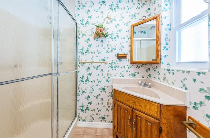 Second bathroom, with walk in shower. Located off of the Family Room.