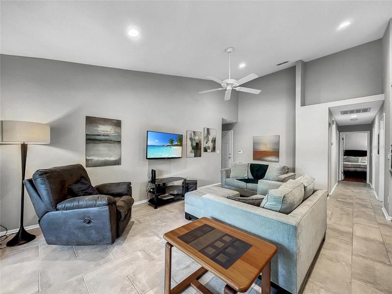 Living Room With Vaulted Ceilings and Ceramic Tile