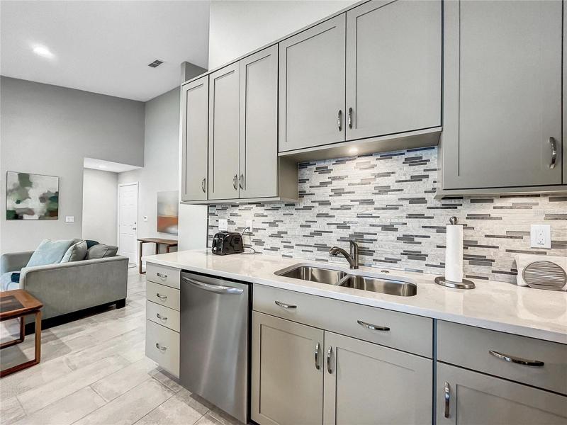 Kitchen View with Updated Solid Service Counter and Beautiful Tile Backsplash