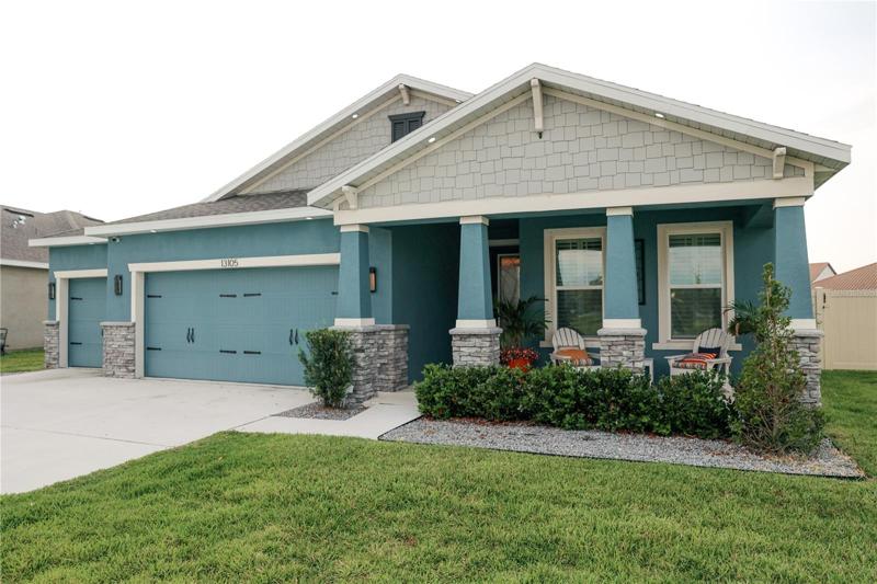Charming craftsman exterior with three garage bays!