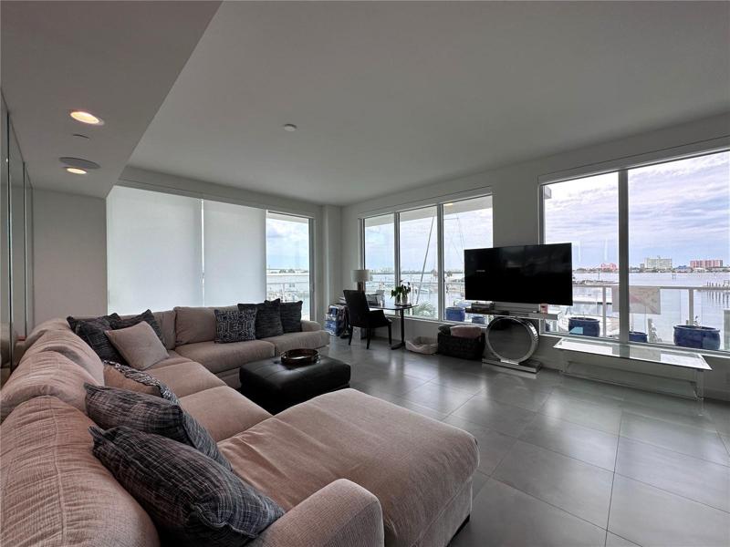 Large, open Living room with built-in shades and more water views
