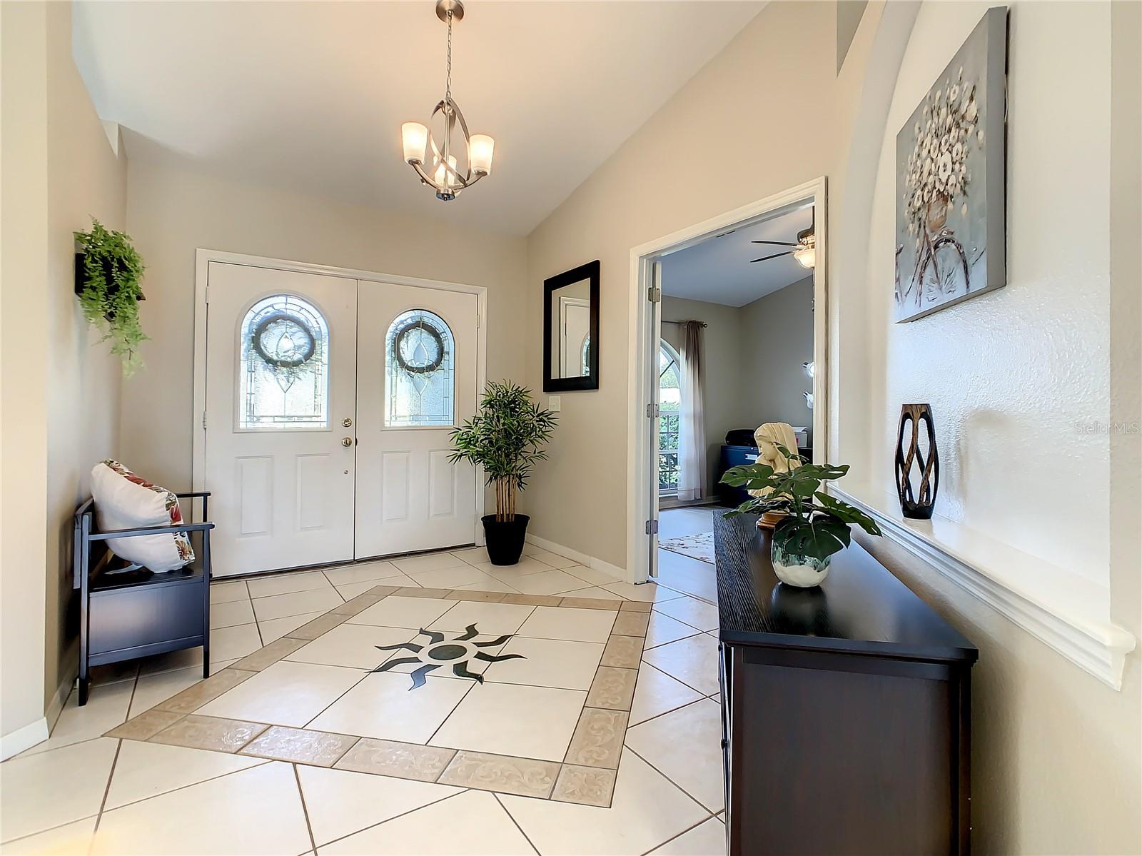 Looking back at the front double entry doors and the foyer area.  Check out the detailed floor pattern.