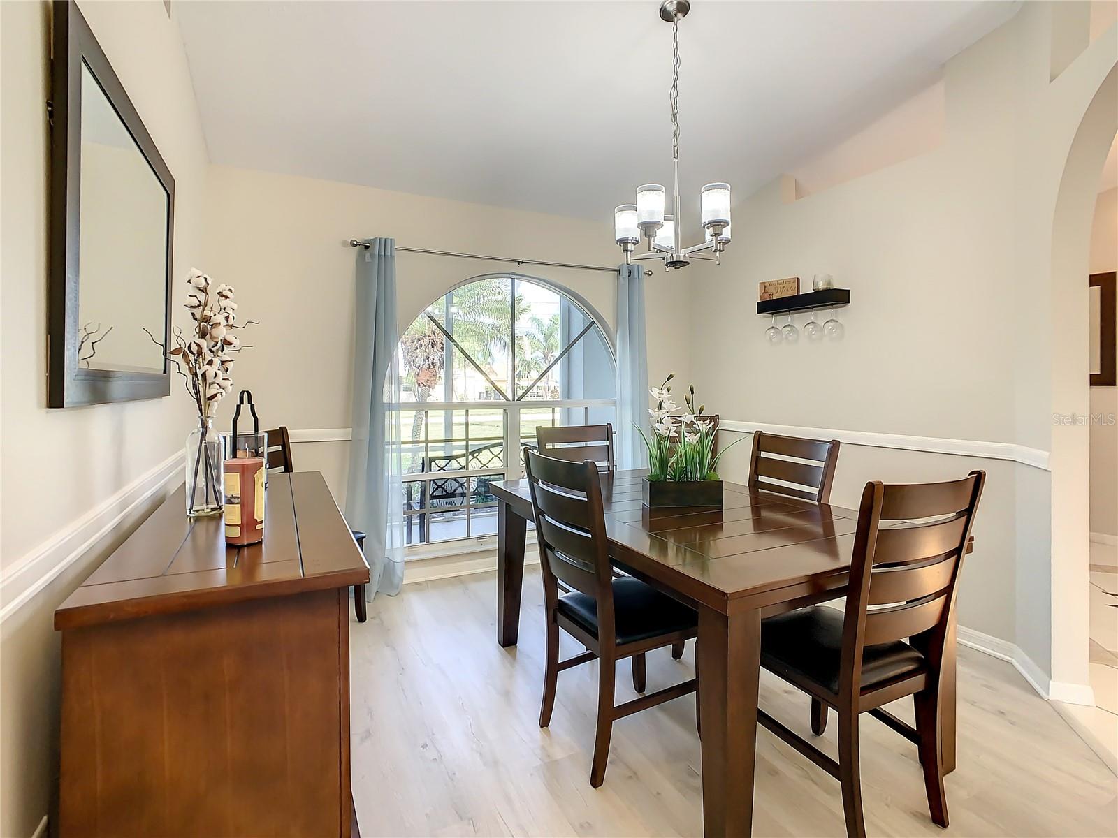 Formal living room with beautiful arched window.