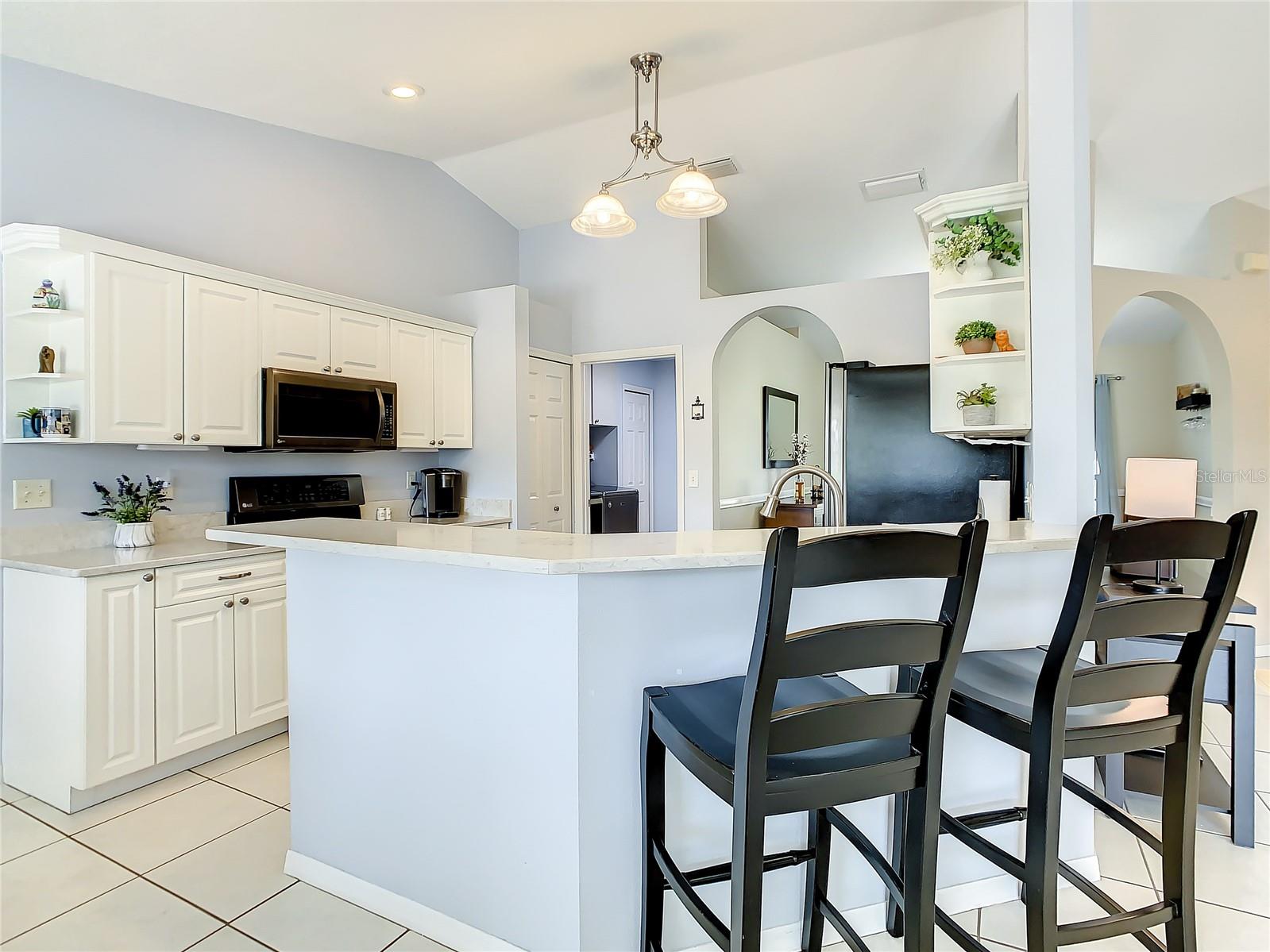 Breakfast bar allows friends to sit and chat while you prepare your next gourmet meal.