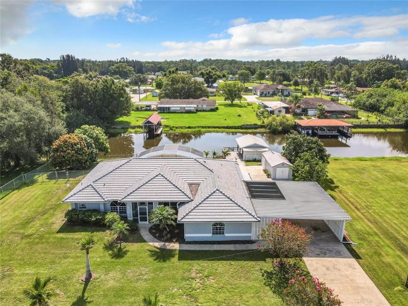 CUSTOM BUILT WATERFRONT & POOL HOME with direct access to LAKE WALK-IN-WATER. "Check out the 3D Interactive Virtual Tour and video tour attached to this listing”