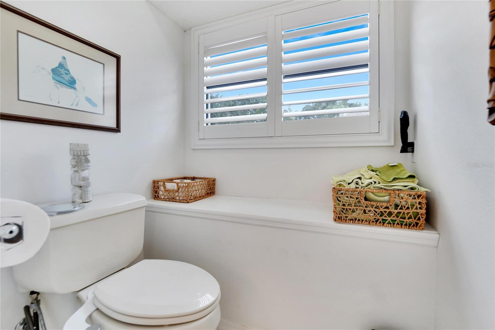 Private water closet with plantation shutters