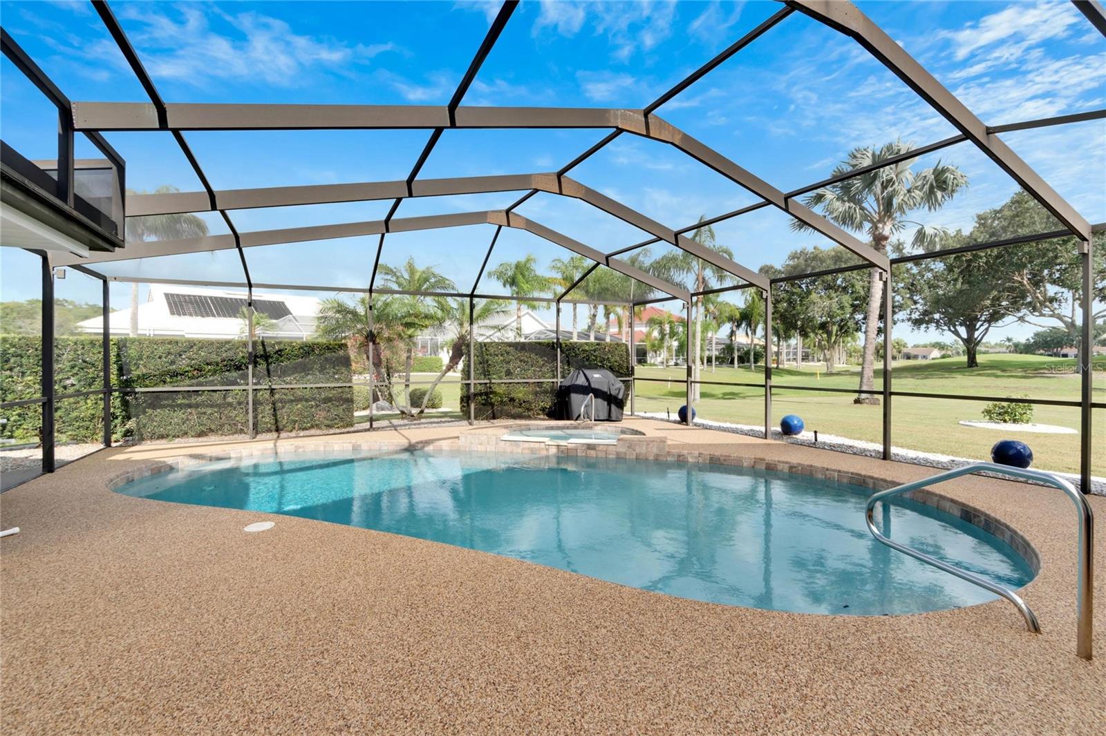 New pebble stone pool deck and refurbished pool and spa