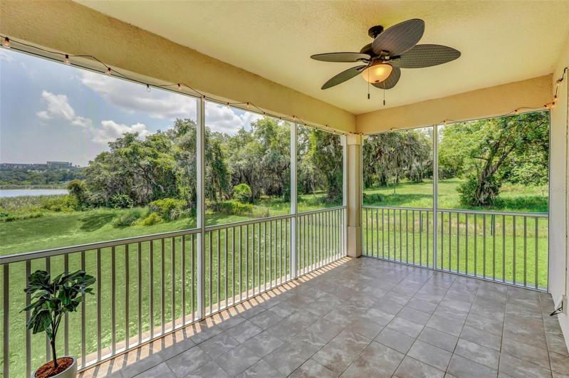 SCREENED IN LANAI OFF OF THE KITCHEN & OWNER'S SUITE BEDROOM