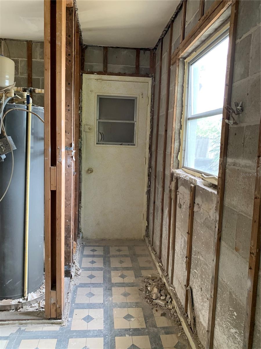 This is an extra area off the Kitchen. At one time this door lead out to the carport but is sealed from the outside so lots of possibilities for this space.