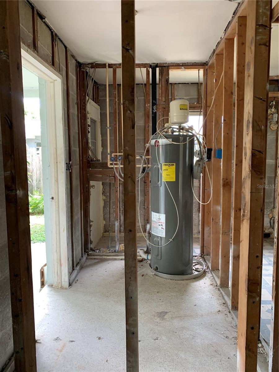 This was the Laundry Room that also houses the Water Heater. It was accessed from the carport area but could be converted to an inside Laundry Room. So much potential!
