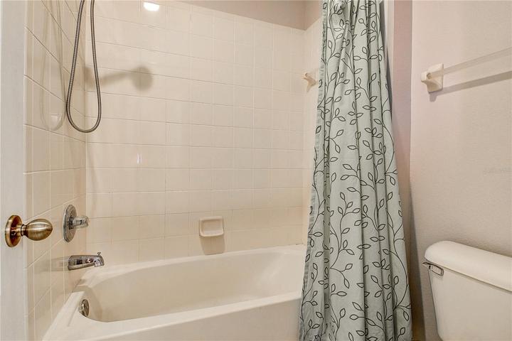 Tub/shower combination in upstairs bathroom.