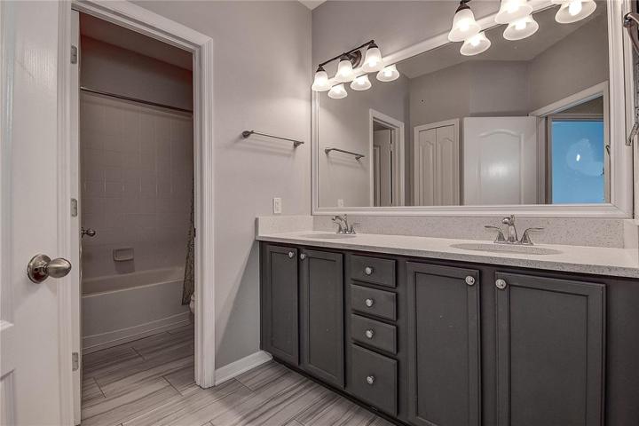 Upstairs bathroom with linen closet.